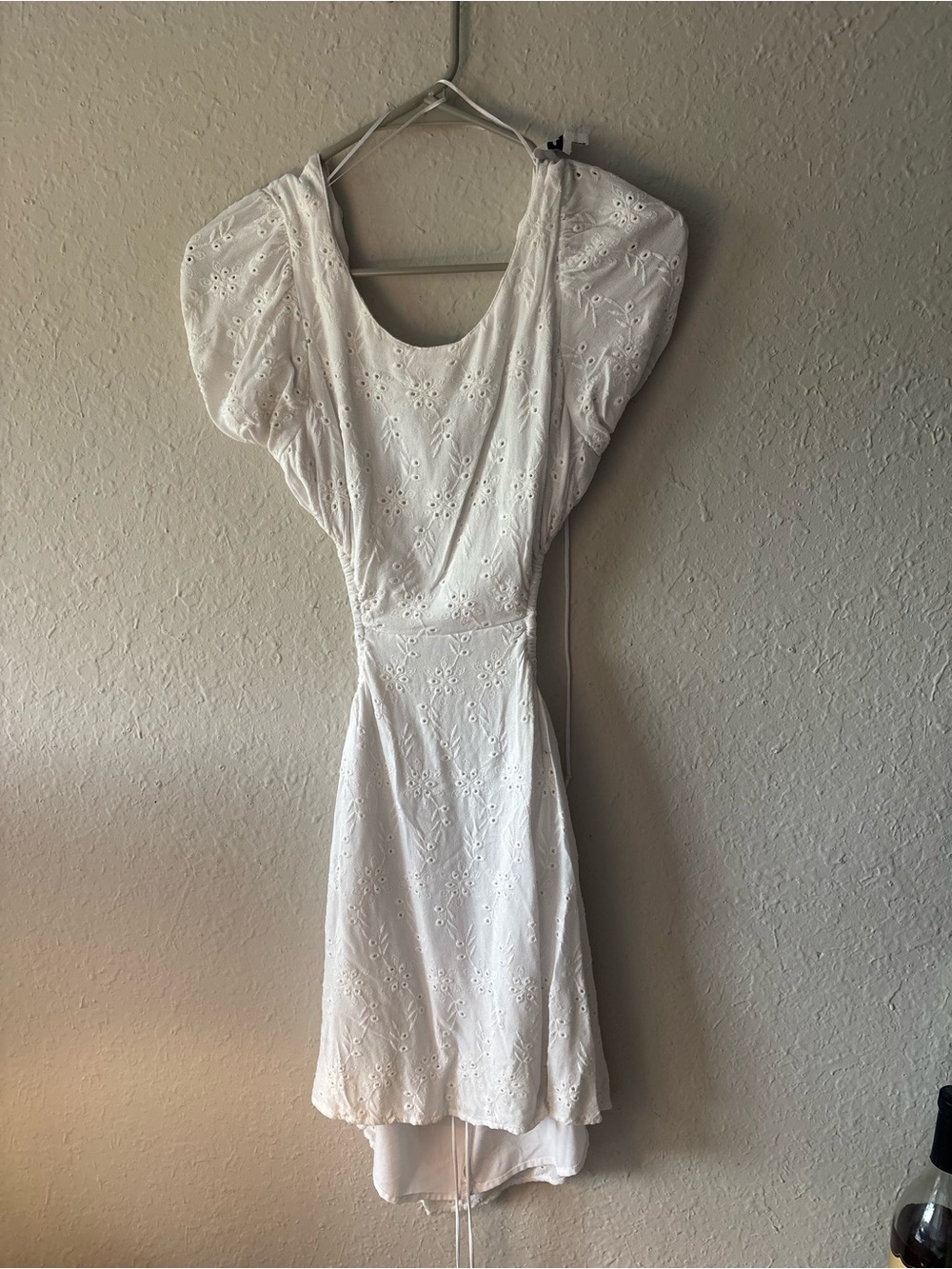Backless white mini dress